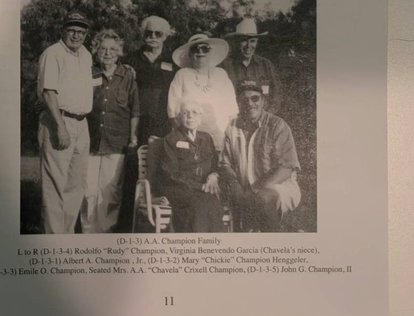 Photograph captioned A.A. Champion Family, showing Rodolfo Rudy Champion, Virginia Benevendo Garcia, Albert A. Champion Jr., Mary Chickie Champion Henggeler, Emile O. Champion, Mrs. A.A. Chavela Crixell Champion seated, and John G. Champion II