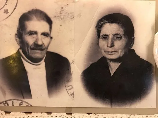 Two oval portraits of an elderly man and woman mounted side by side on card.