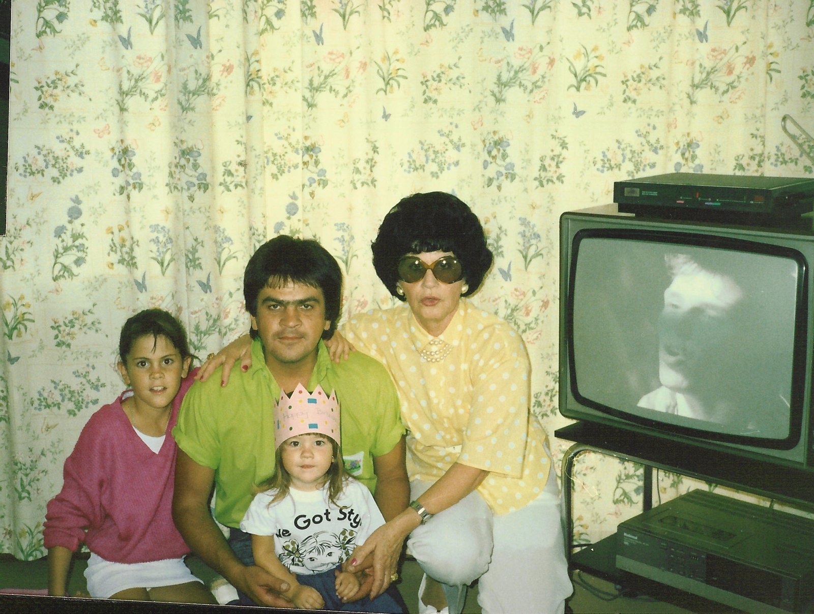 Colour family photograph, 1980s, with television and video recorder