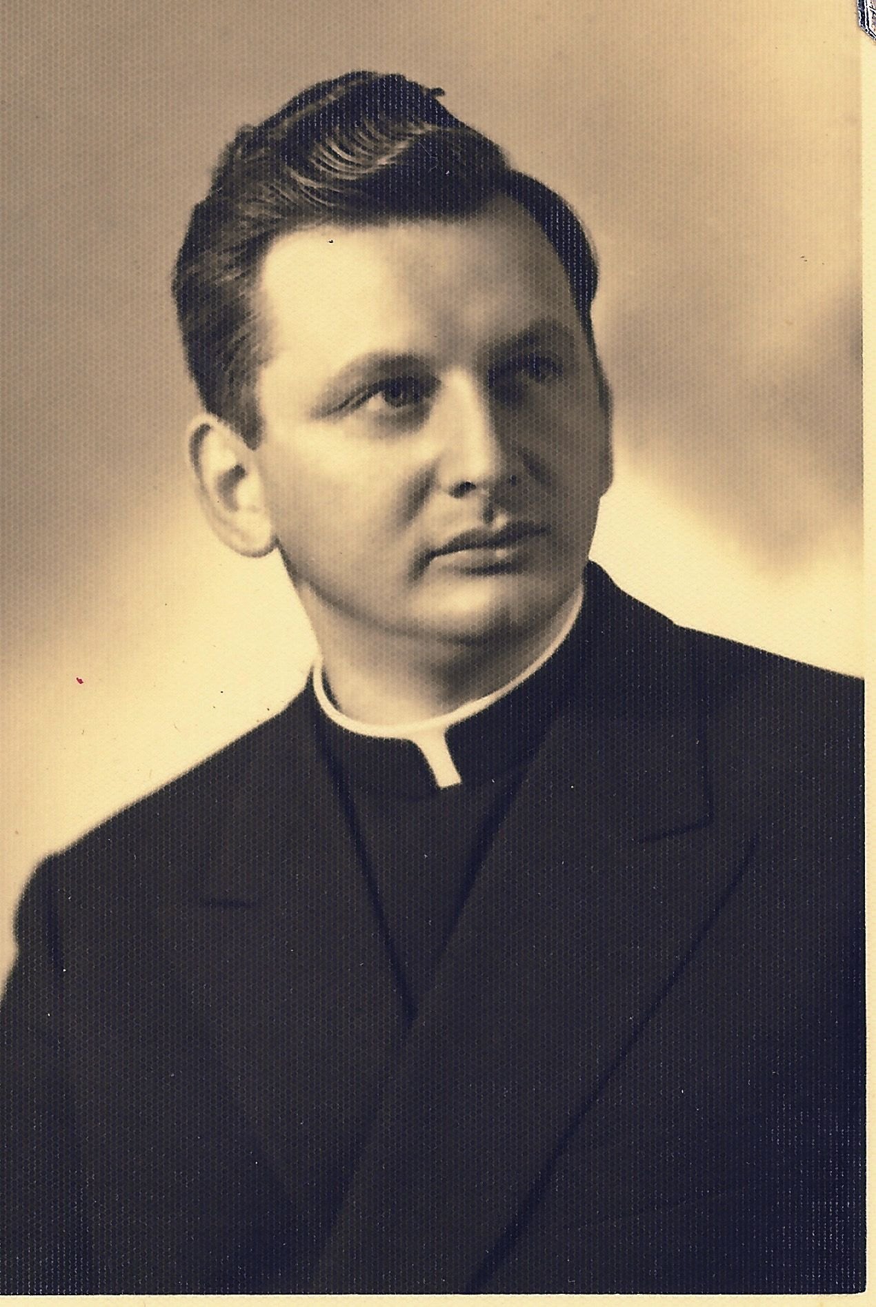Studio portrait of Antun Kosina in a cassock and Roman collar