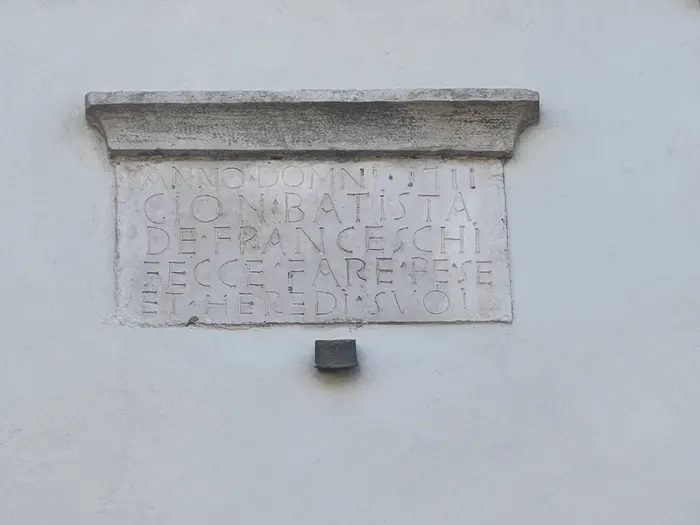The builder's tablet, on the front of the house